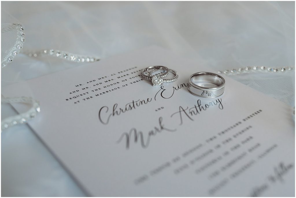 wedding rings on wedding invitation detail shot
