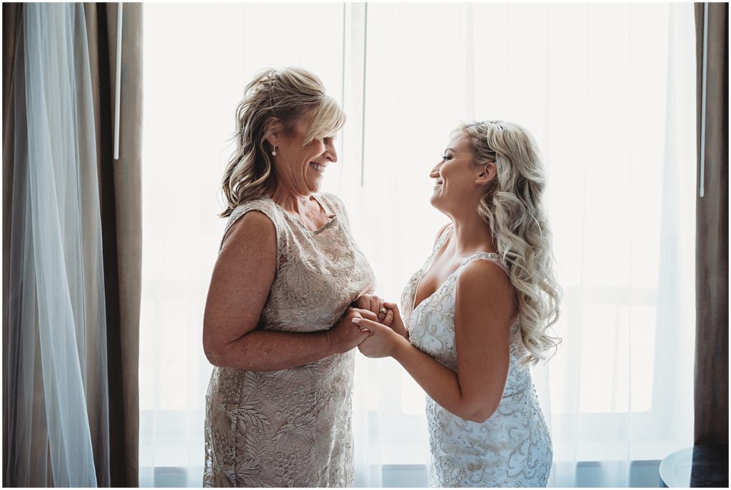 bride with mom first look