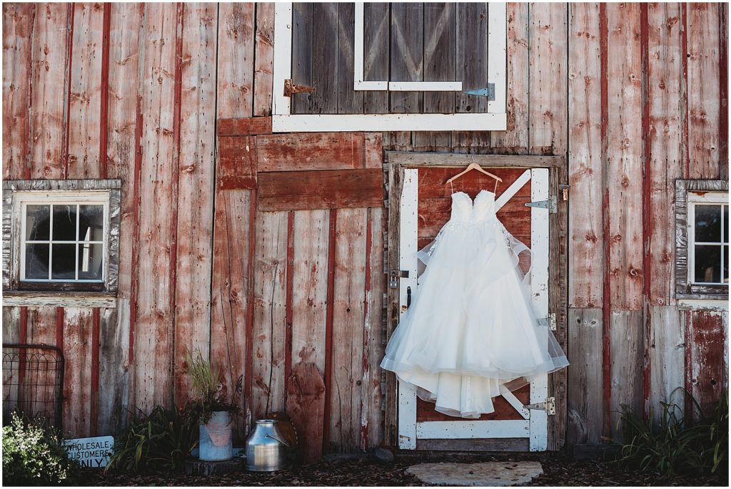 dress hanging on barn, barn wedding, country wedding