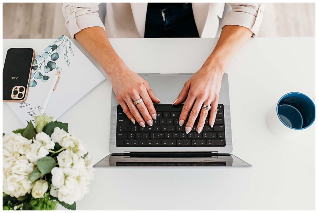 woman working on laptop on desk