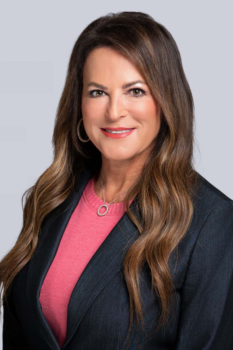 Professional Headshot of Women in Pink Shirt and Blue Blazer. Photo taken by Rosemont Headshot Photographer Lisa Kay