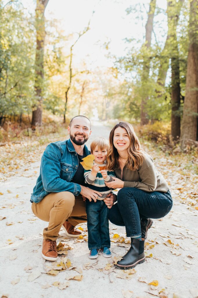 Family in forest in the fall
