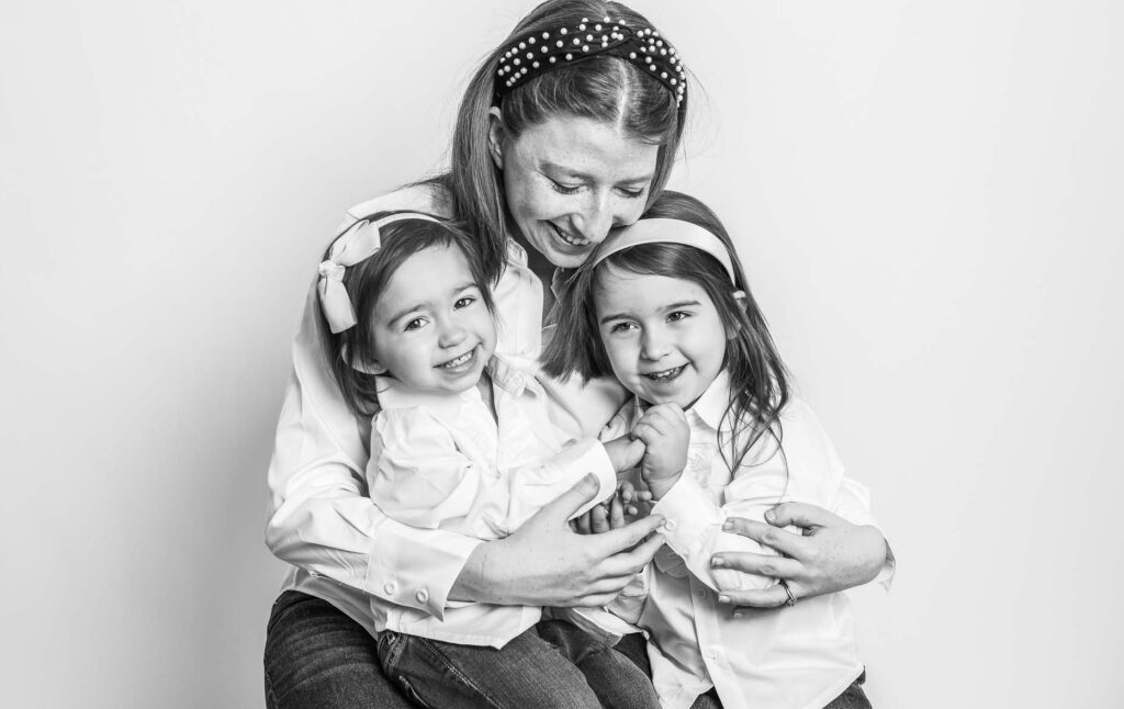 Mother with 2 little girls black and white photo