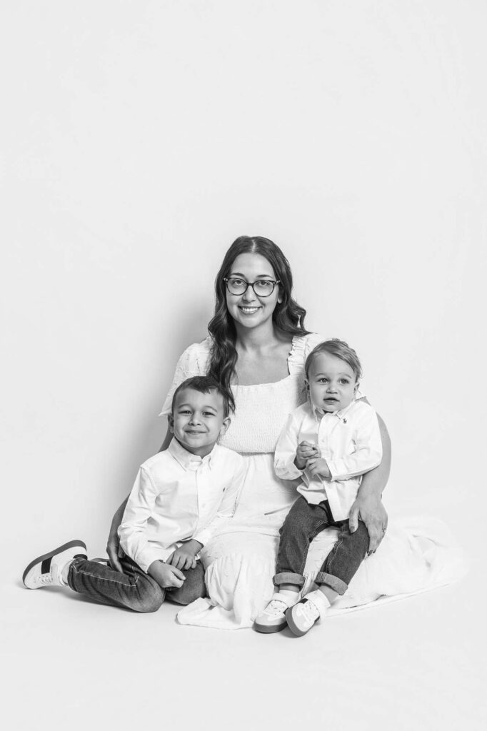 Photo of Mom with two young sons in black and white