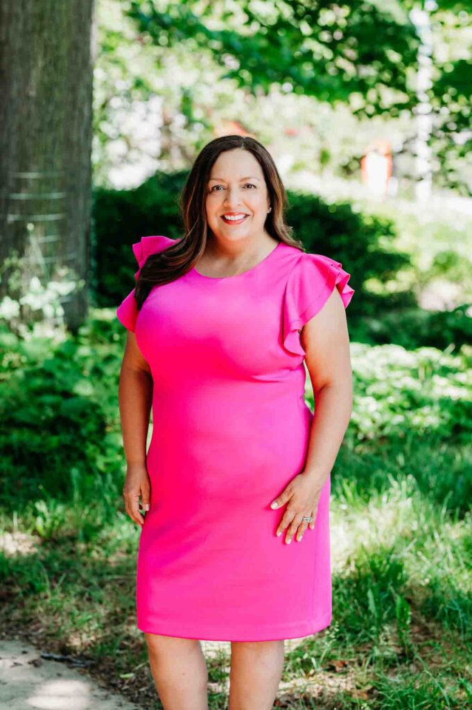 Woman in bright pink dress outdoor